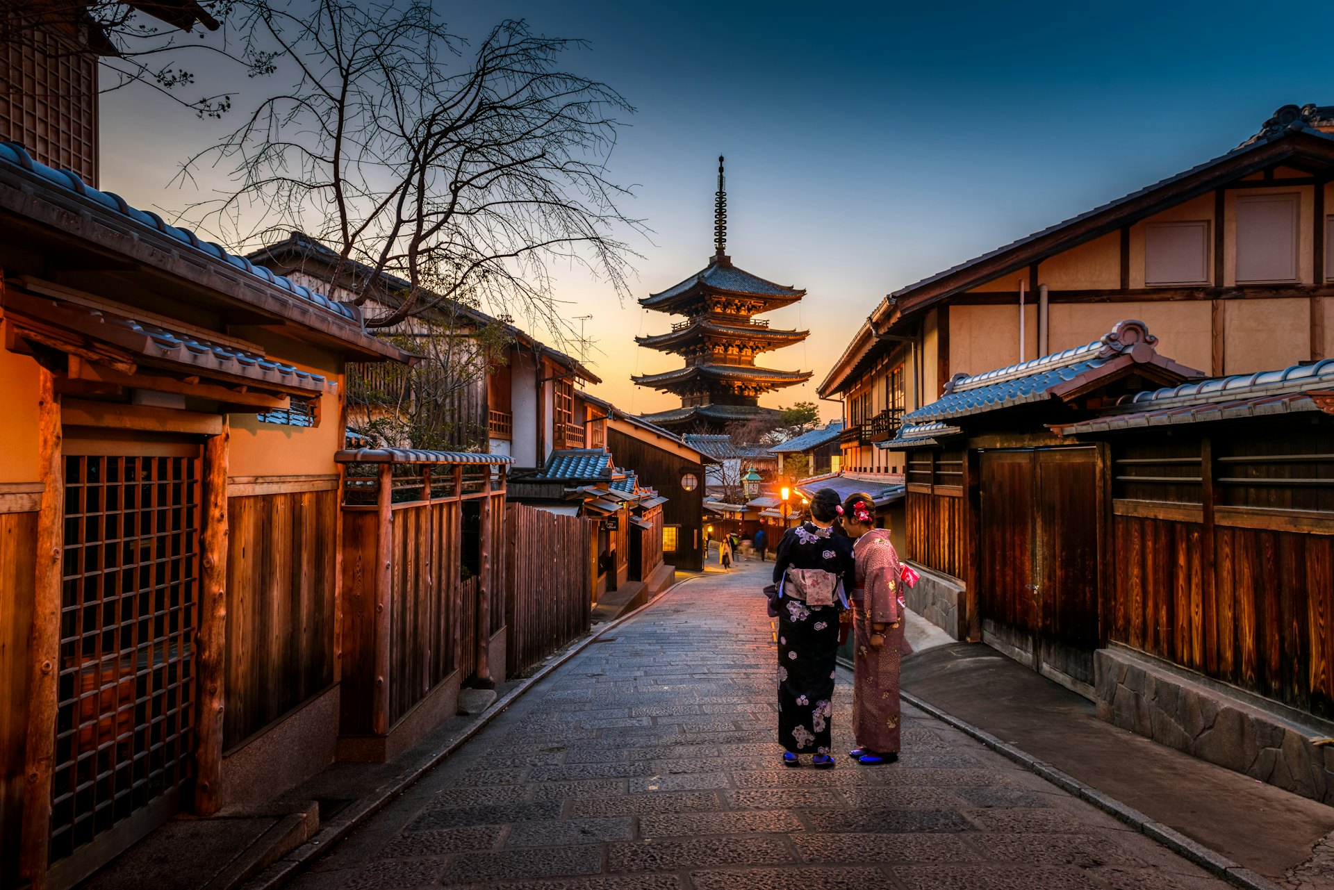 A couple in kimono in old Kyoto at dawn